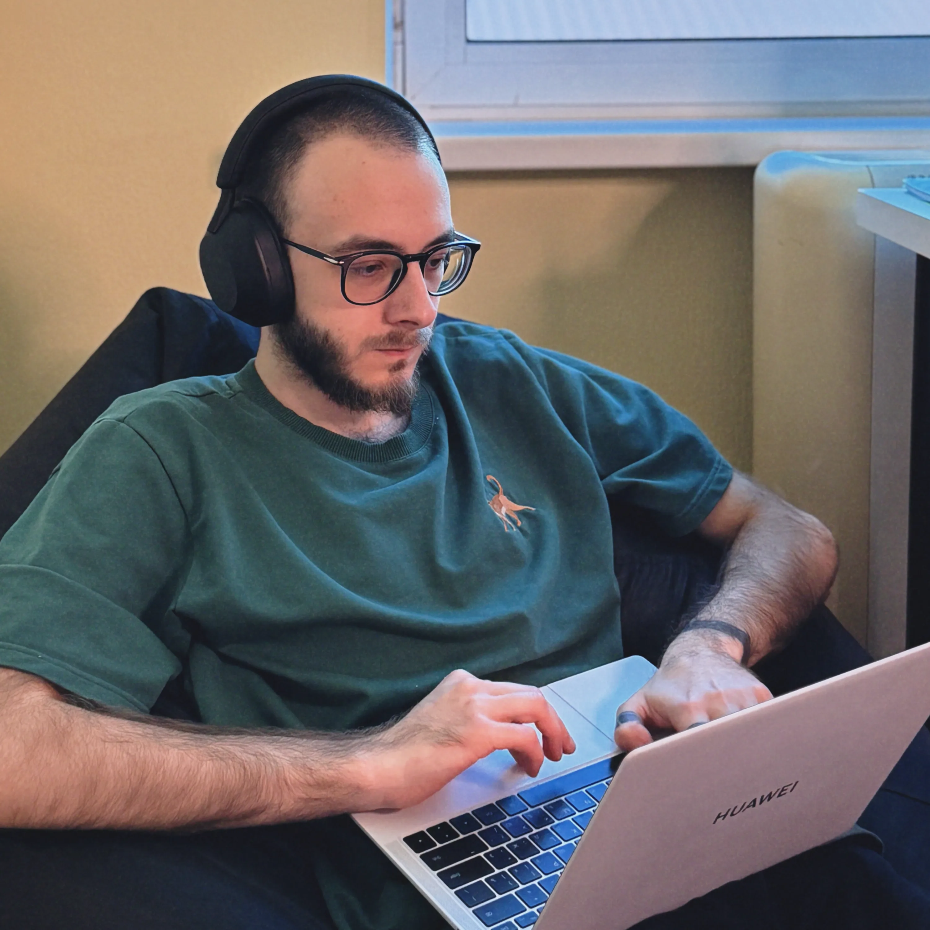 Team member working on a laptop